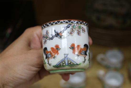 A set of Chinese famille rose cockerel cups, saucers and plates, early 20th century